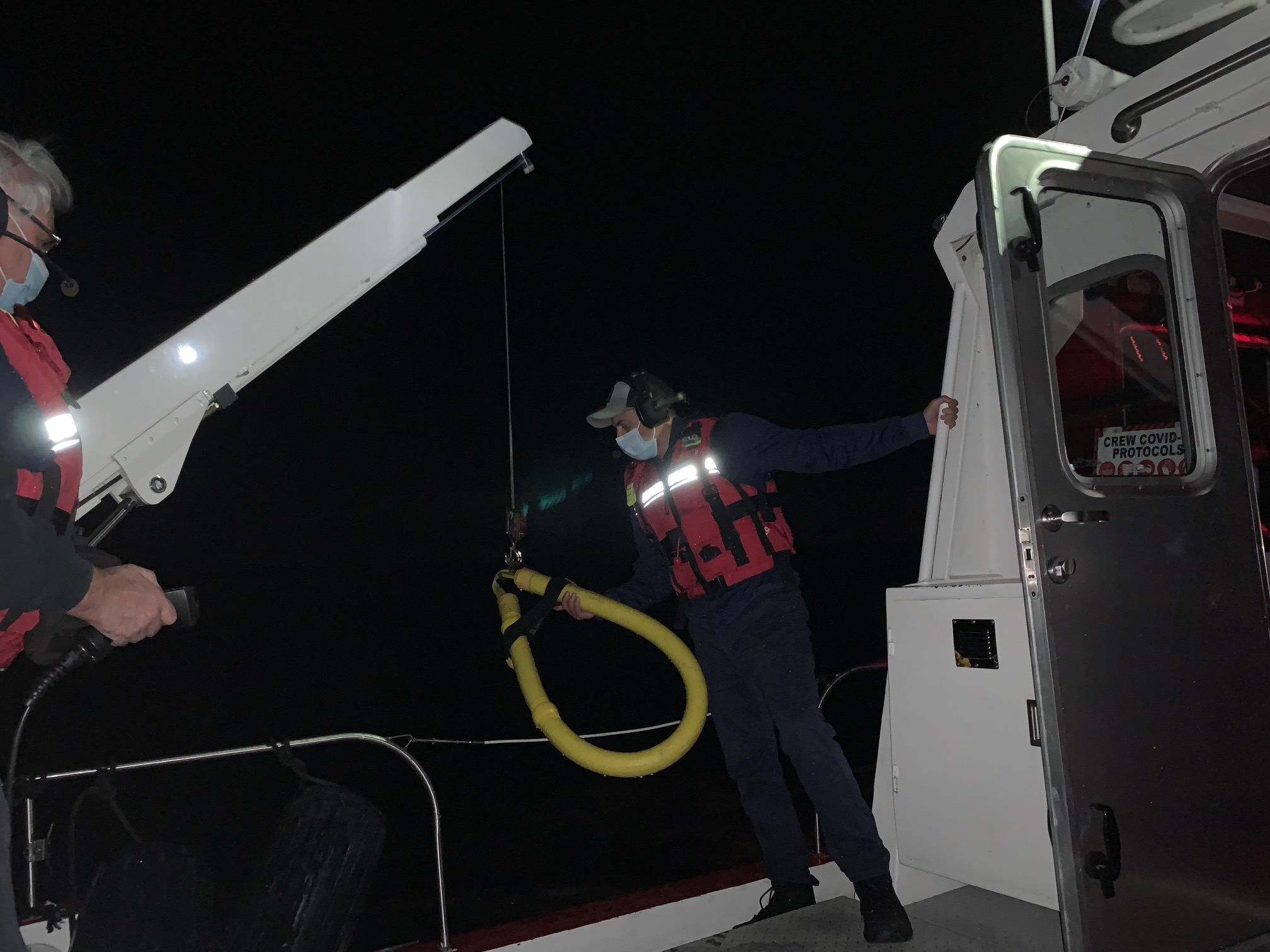 Preparing to recover a PIW (Person in Water) using Horse Collar and hydraulic davit